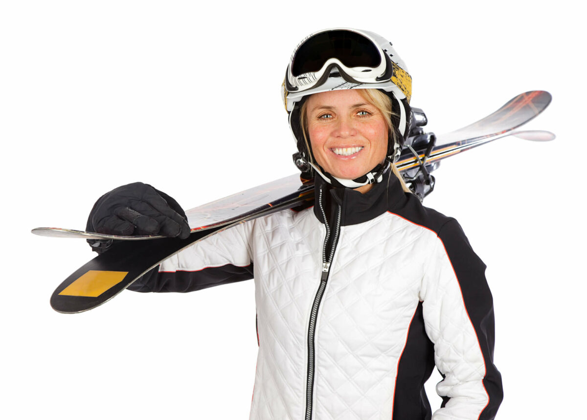 Woman Carying Skis